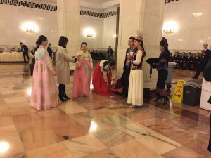 Inside the People's Great Halls, members wearing traditional costumes 